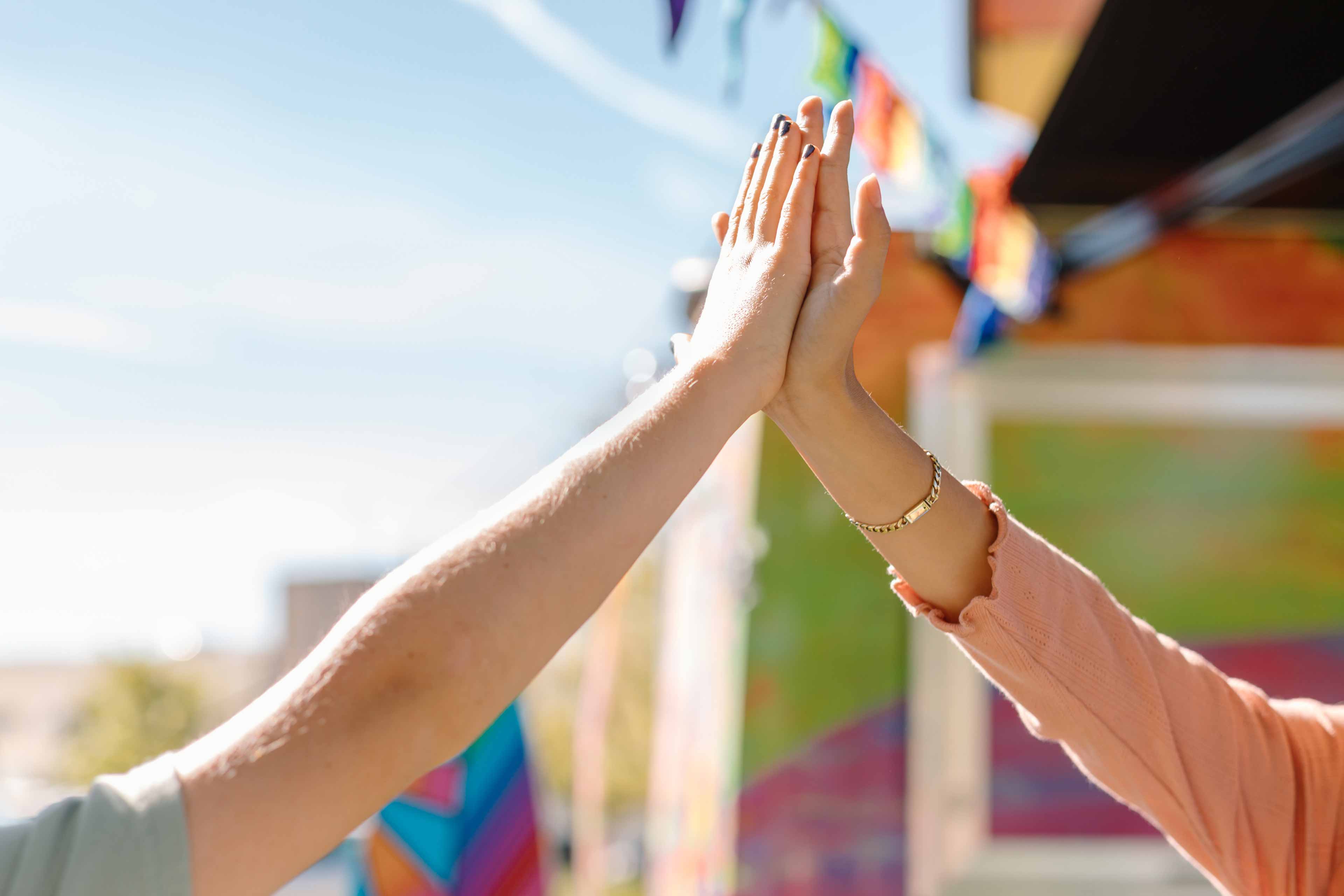 two kids doing a high five