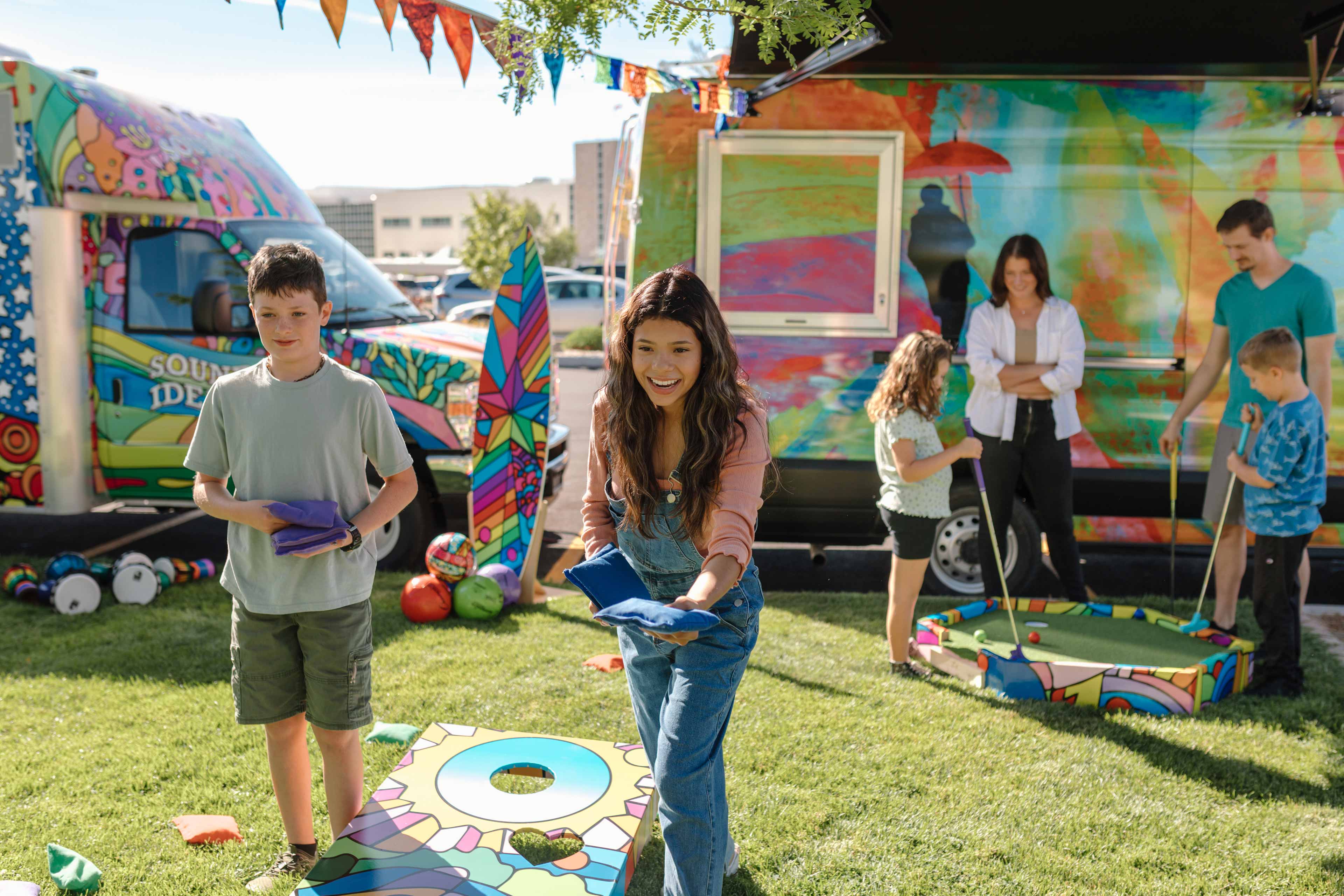 kids having fun playing cornhole