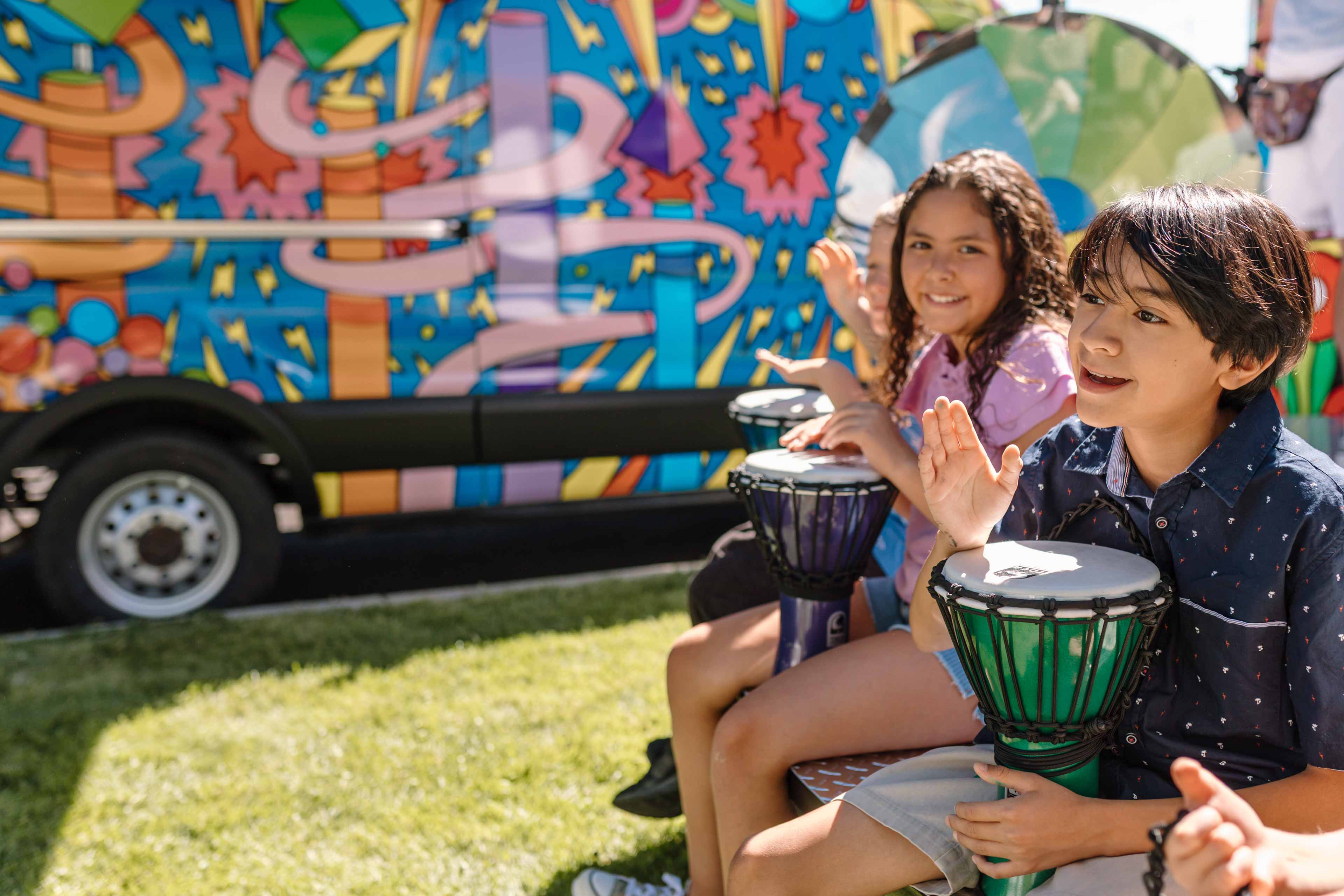 kids playing with toy drums