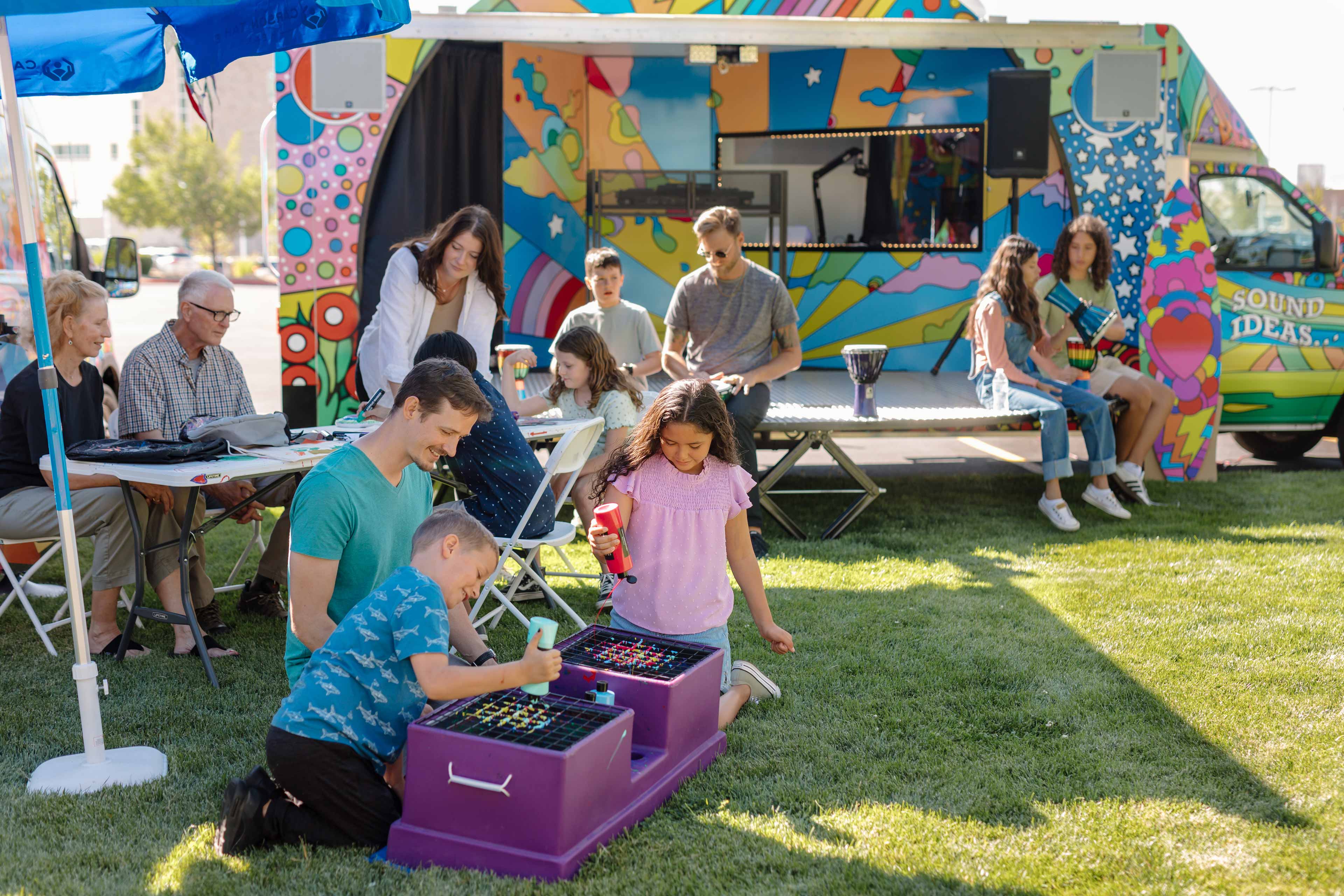 kids with their parents playing with color painting