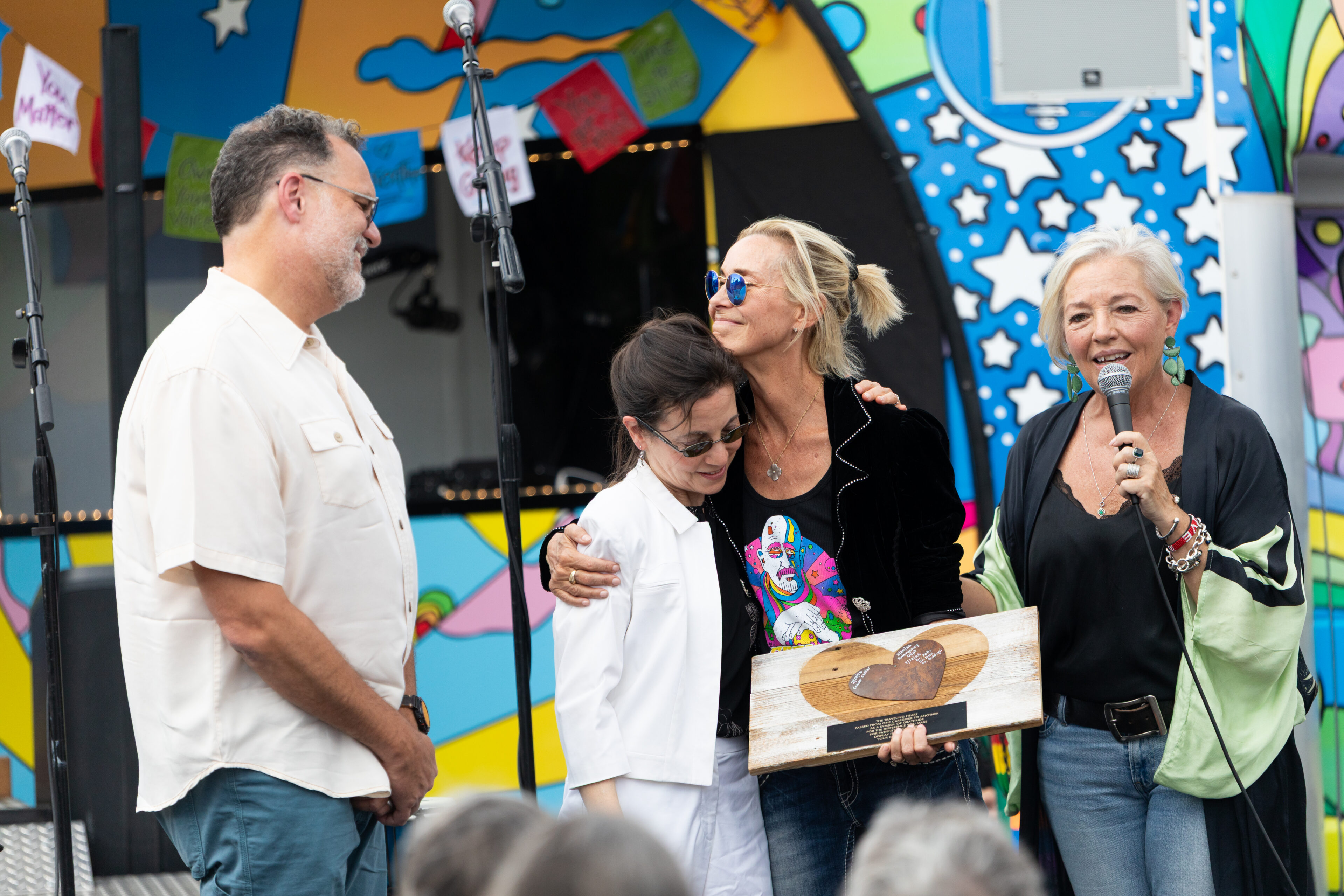 Carson Tahoe Health Vice President of Community and Patient Experience Kitty McKay presents a Grateful Patient Heart Award alongside wife and Dave Mason Music CEO Winifred Wilson to Dr. Craig Rau, MD and Dr. Cathy Petti, MD of Carson Tahoe Health at the Dave Mason Legacy Dedication and Benefit Concert on Sunday, July 12, 2026 in Carson City, Nev. (Trevor Bexon/AP Content Services for Carson Tahoe Health)