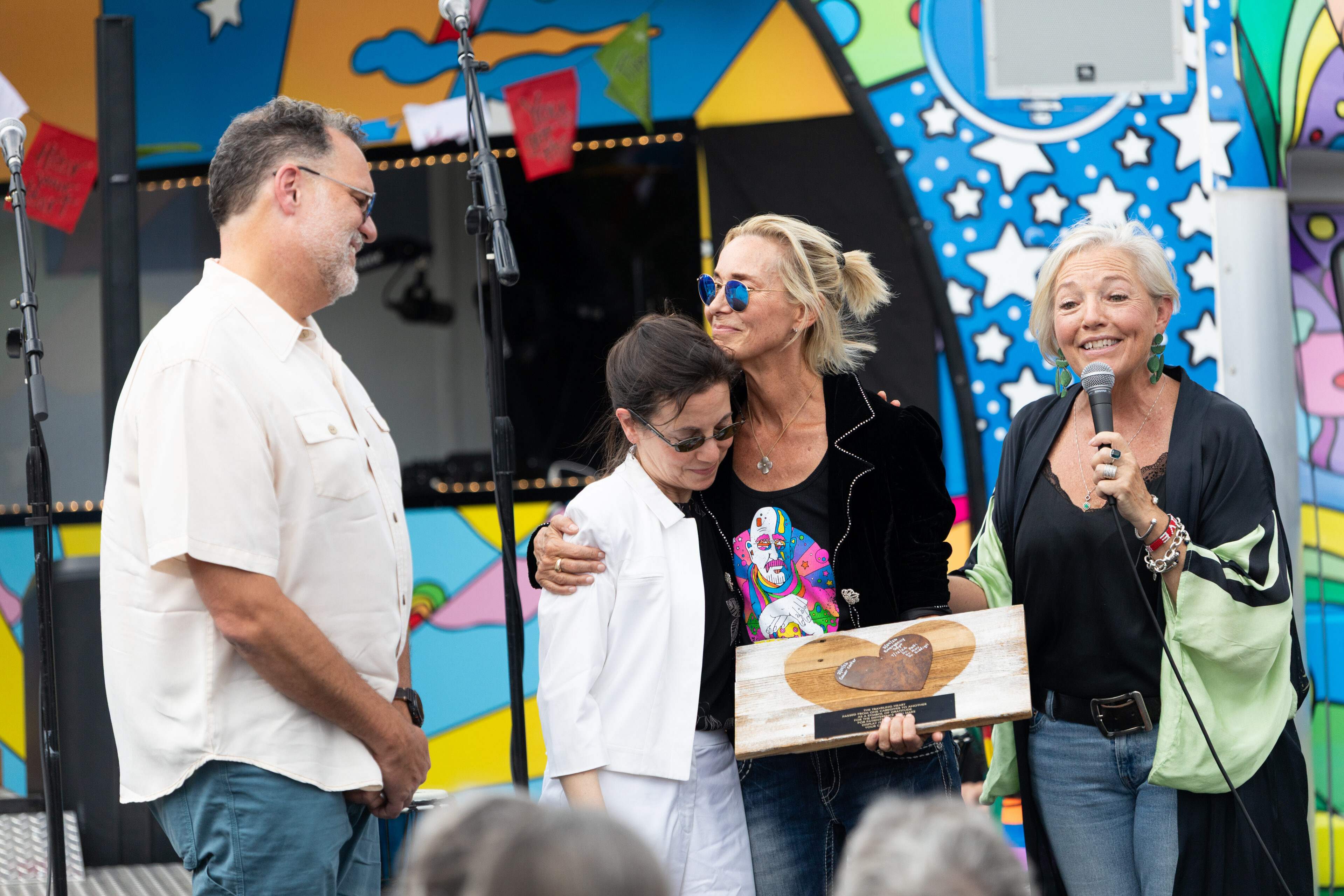 Carson Tahoe Health Vice President of Community and Patient Experience Kitty McKay presents a Grateful Patient Heart Award alongside wife and Dave Mason Music CEO Winifred Wilson to Dr. Craig Rau, MD and Dr. Cathy Petti, MD of Carson Tahoe Health at the Dave Mason Legacy Dedication and Benefit Concert on Sunday, July 12, 2026 in Carson City, Nev. (Trevor Bexon/AP Content Services for Carson Tahoe Health)